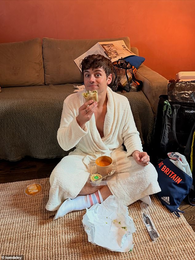 In another morning snap, the retired diver donned a white robe as he tucked into some delicious food