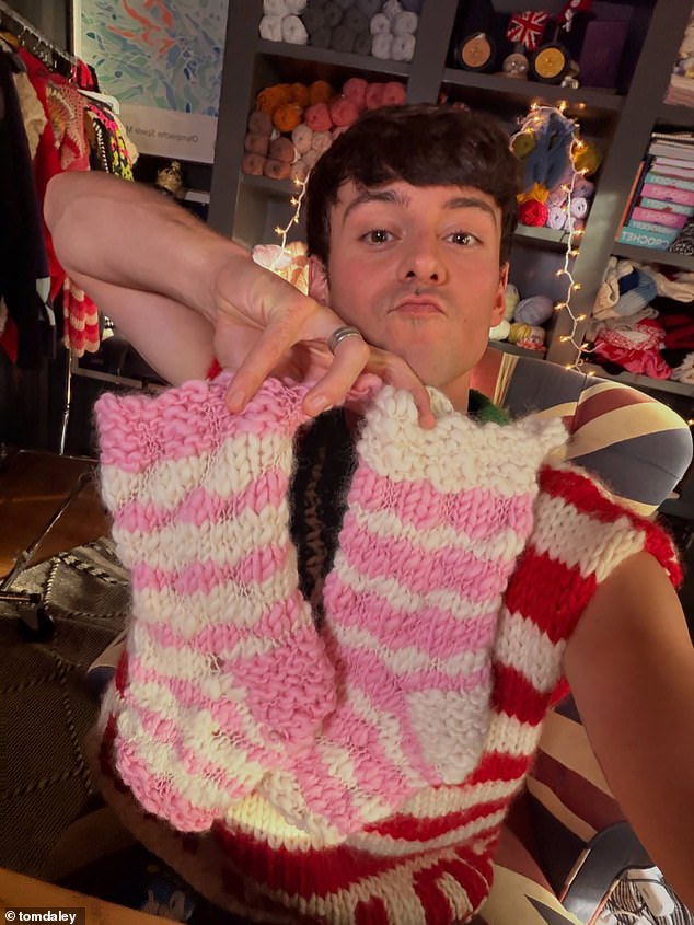 In true Tom fashion, he also posted a snap holding up a pair of pink and white knitted socks, yet another creation from his ever-growing collection