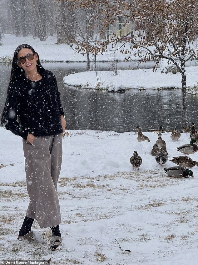 American actress Demi Moore, 63, enjoyed a snowy day as she wished her followers well this festive season
