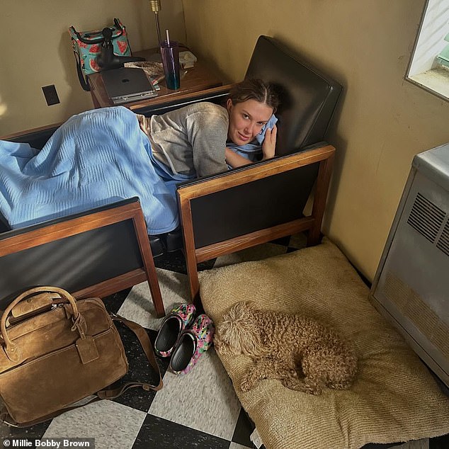 In one snap, the actress could be seen relaxing on two chairs beside her pooch as she took a break from work
