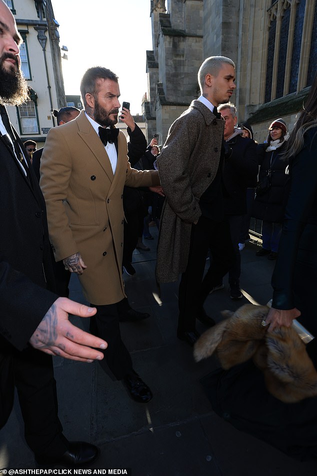 David and his son Romeo make their way into the Abbey ahead of the nuptials