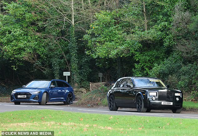 Holly makes her way over in a black car to the Abbey for the ceremony this morning