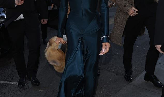 Victoria and David Beckham arrive at Holly Ramsay and Adam Peaty's wedding at Bath Abbey today