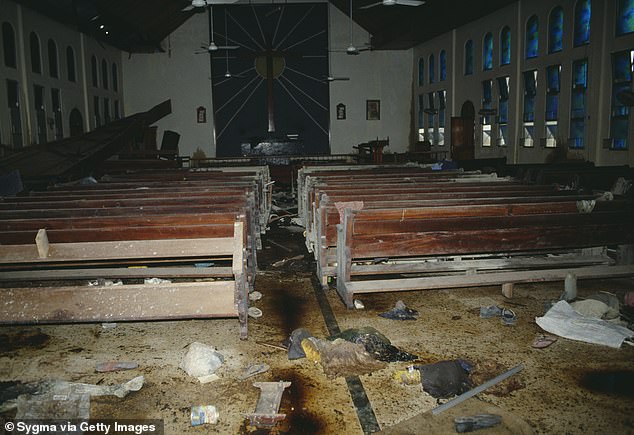 The bloody aftermath of the church massacre. Items of clothing are seen scattered across the floor as pools of blood remains