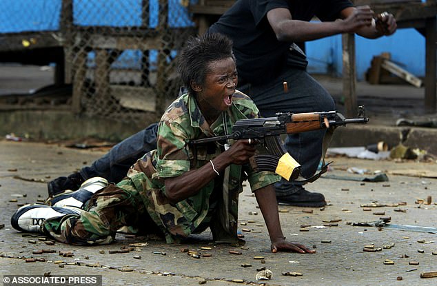 A government soldier opens fire against rival factions at the Via Town bridge in April 2004