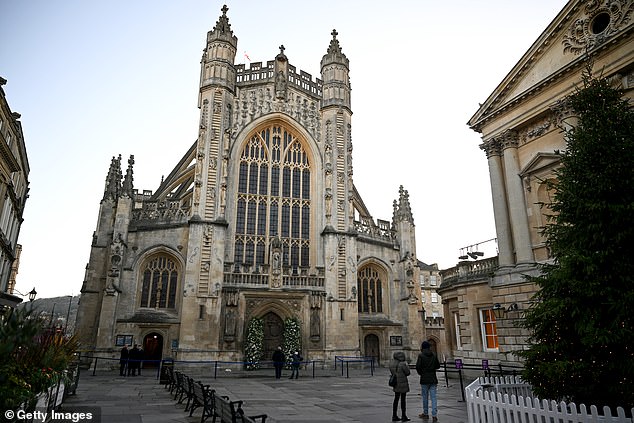 After being kicked off the invite list, James posted an old photograph on the day with their mother Caroline Peaty standing outside of the wedding venue (stock image Bath Abbey)