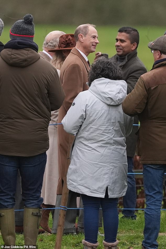 The Duke of Edinburgh wears a muted brown coat paired with grey trousers at Sandringham today