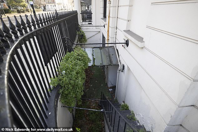 Pictured: The entrance to the ground floor flat. The renovations stripped out original features and left the period home looking more like a boutique hotel