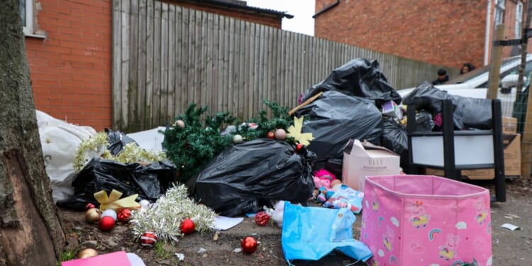Fury as mountains of Christmas rubbish pile up on the streets of Birmingham after nearly 12 months of bin strikes