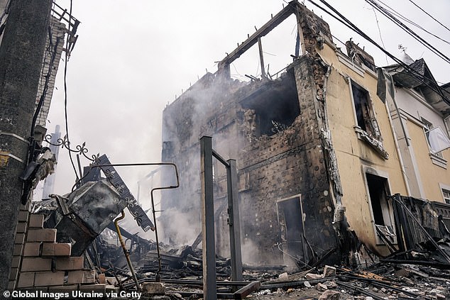 It comes just a day after Russia launched a barrage of missiles on Kyiv, killing at least one person and injuring 20 more, per the mayor of the Ukrainian capital. (Pictured: A private residential building in the Darnytskyi district after a Russian drone strike on Saturday)