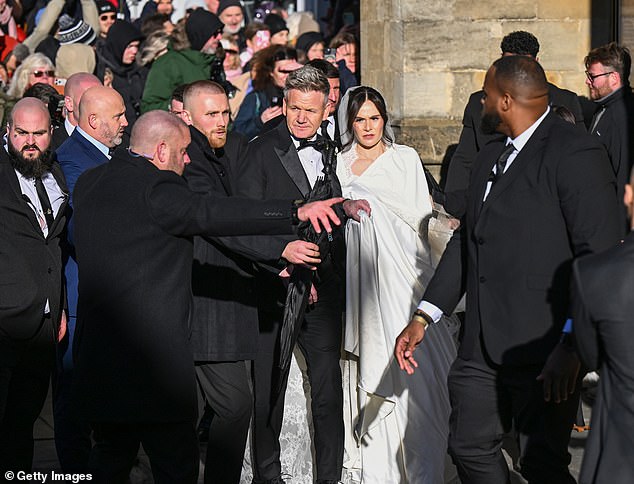 One attendee said: 'It was a lovely day, but with the wristband it felt more like a hospital appointment  (Holly pictured with dad Gordon)