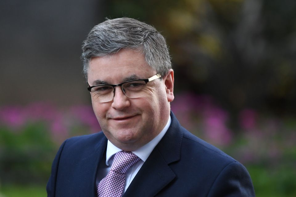 Britain's Justice Secretary Robert Buckland walks through Downing Street.