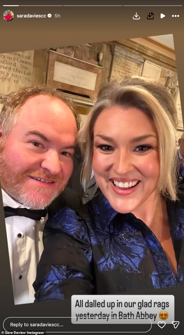 She was joined by her husband Simon and wore a pretty blue and black flower patterned dress for the wedding