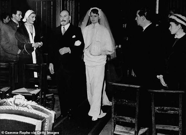 Bardot's parents did not initially approve of her union with Vadim but agreed to her marriage after she attempted suicide. Above: Being walked down the aisle by her father, December 19, 1952