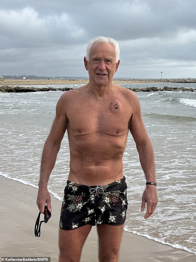 David Howarth collapsed when walking along an empty Sandbanks beach in Poole after enjoying a dip in the sea - and has had a tattoo of a paw inked over his pacemaker