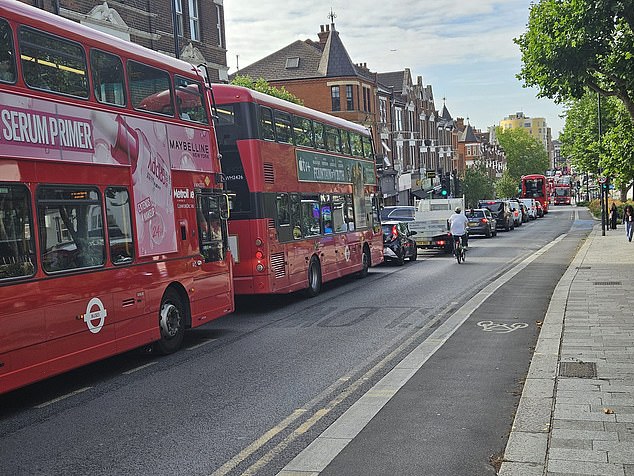 Traffic piles up in Queen's Park. Families living near the LTN are pushing to have the scheme scrapped