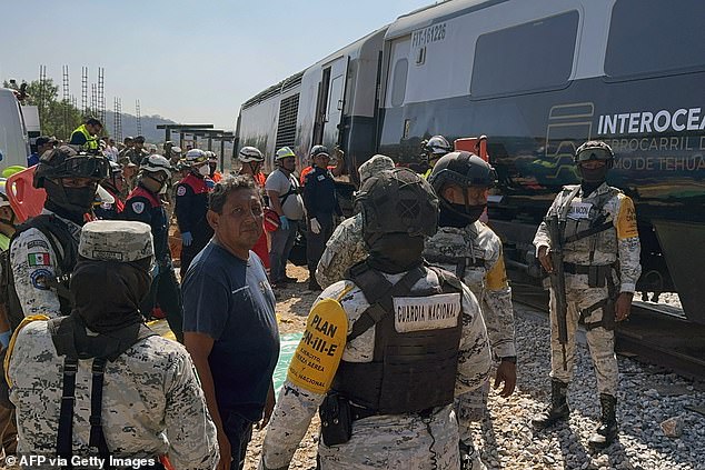 Mexican Army soldiers and Civil Protection members rescue passengers from the carriage