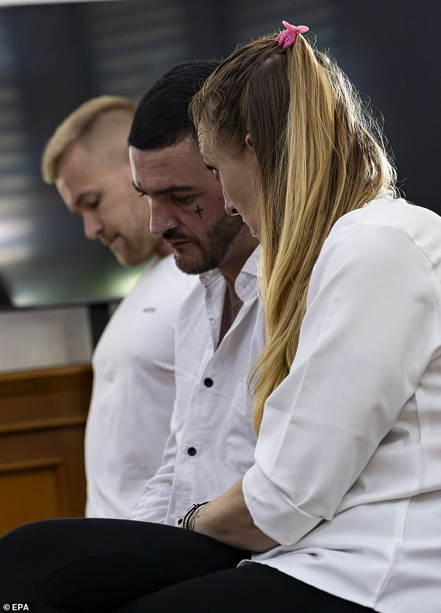 (L-R) Phineas Float, Jonathan Collyer and Lisa Stocker of Britain sit inside a court room for their trial at the Denpasar district court, in Denpasar, Bali, Indonesia, July 15 2025