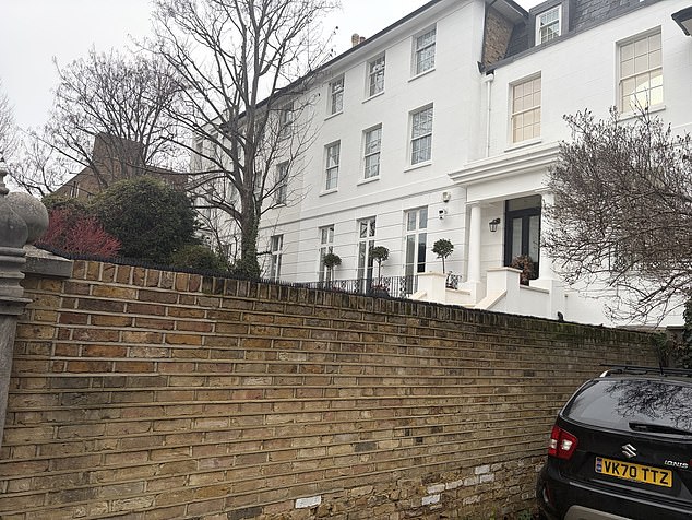 Pictured: The newly erected metal spikes on the bordering walls of the Notting Hill house