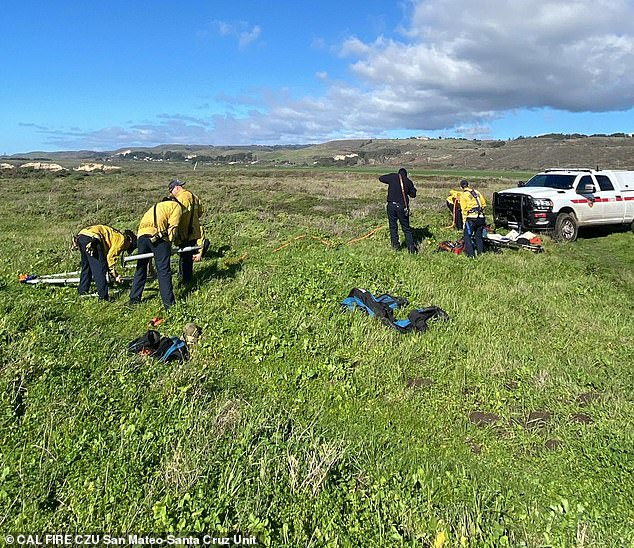 Cal Fire personnel are seen preparing to retrieve Fox's body on Saturday