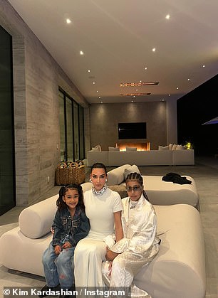 Kim's beige bathroom and living room pictured