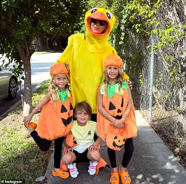 The mother-of-four shared a photo with three of her kids this past Halloween