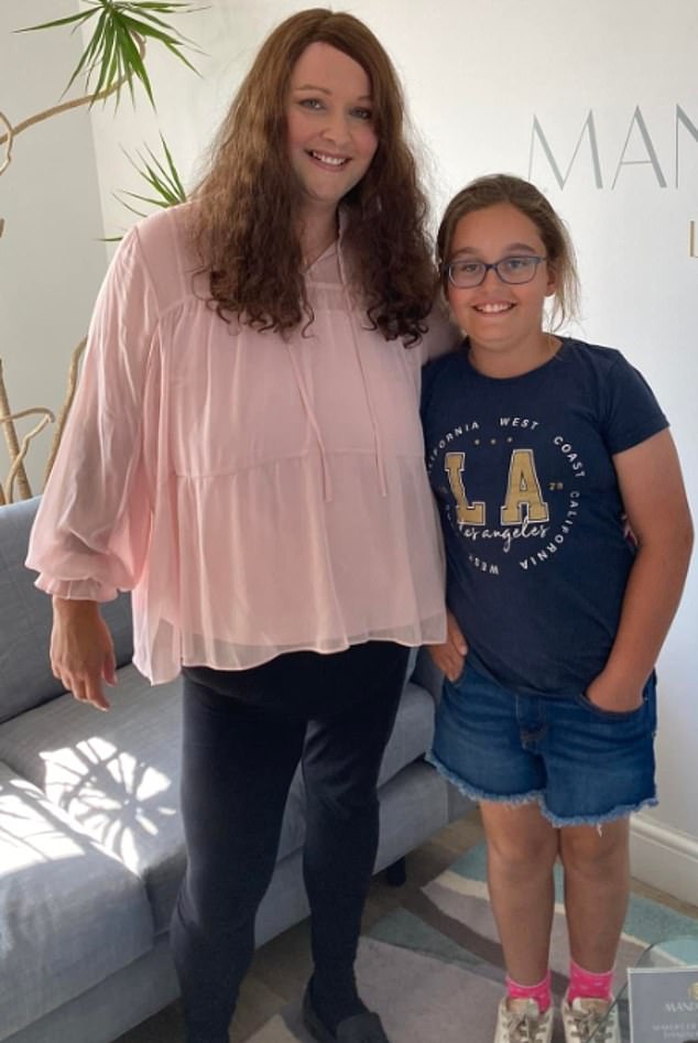 Lily with her mother Anne Marie, who remains in hospital after the fire on Sunday