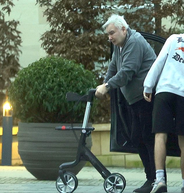 Eamonn kept it casual in a grey hoody and black trousers as he used his walker in the car park
