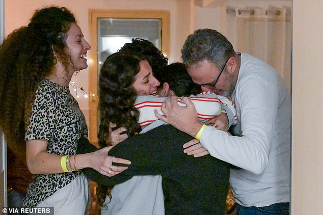 Romi Gonen embraces loved ones at Sheba Medical Centre in Ramat Gan, Israel, 471 days after she was kidnapped