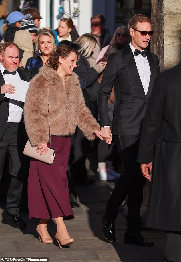 Dan cut a dapper figure in a tuxedo while Sarah stunned in a purple dress, fur coat and heels