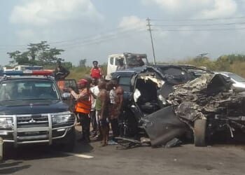 An SUV can be seen completely totalled in grim pictures taken by eyewitnesses, while a Mitsubishi believed to be part of Anthony Joshua's convoy sits undamaged just yards away