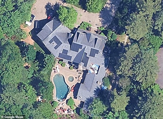 The fire erupted at the sprawling 2,500 square-foot mansion, which boasts six bedrooms and seven bathrooms, around 5am on December 24. Pictured the Corrigan home in Needham, MA