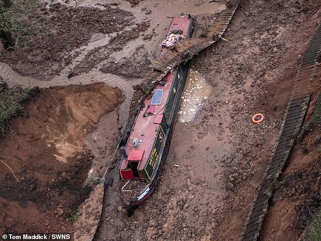 The canal bank collapsed leaving large volumes of water escaping into the surrounding land