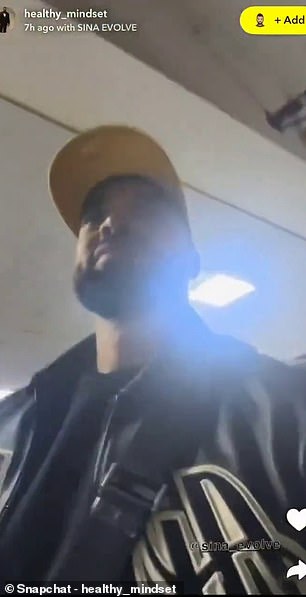 Ayodele is pictured in the video