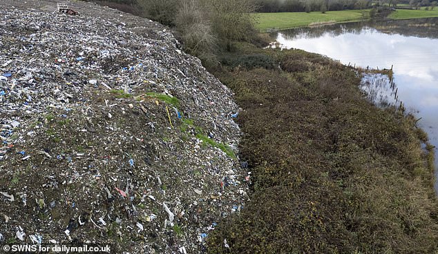 A large pile of waste situated yards from the old Herefordshire and Gloucestershire Canal