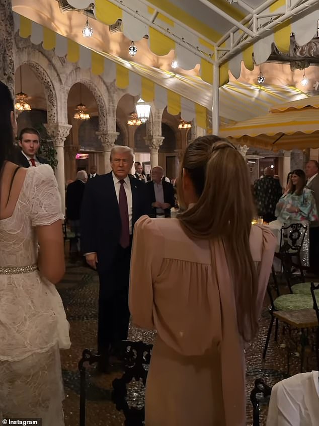 Barron was caught at his father's side during the holiday festivities at Mar-a-Lago