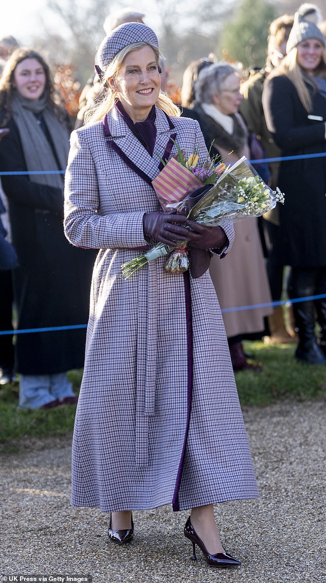 Even Sophie, in her floor length Suzannah brown and burgundy coatdress felt an a throwback to a different era - comfortably retro whilst still managing to patronize a contemporary designer