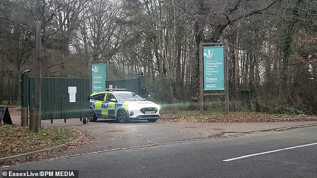 People are being urged to stay away from the scene as officers investigate the crash (pictured: a police vehicle at the entrance to the reservoir)