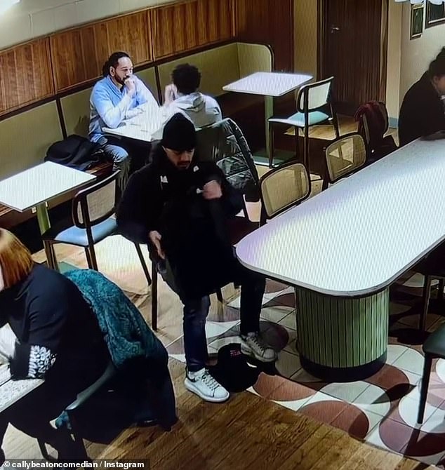 Footage shows the first man returning from the toilet before using his foot to sweep the bag towards him, as the second man then heads to the toilet