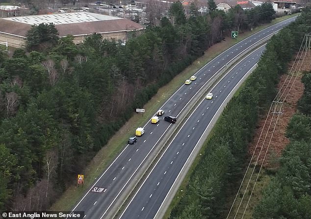 An aerial image shows the scene of the A11 dual carriageway near Thetford, where a suspected gunman was shot dead by police after a crash