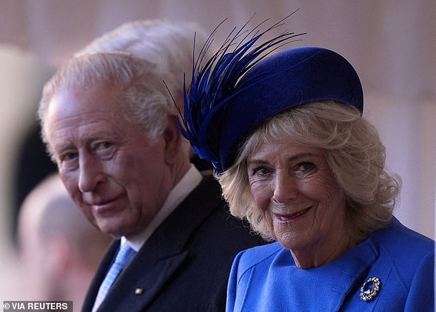 Britain's King Charles III and Queen Camilla attend the ceremonial welcome at Windsor Castle on December 3