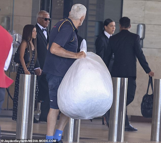 Kerr's dad Roger (pictured second from left) was seen accompanying her as she left the hotel