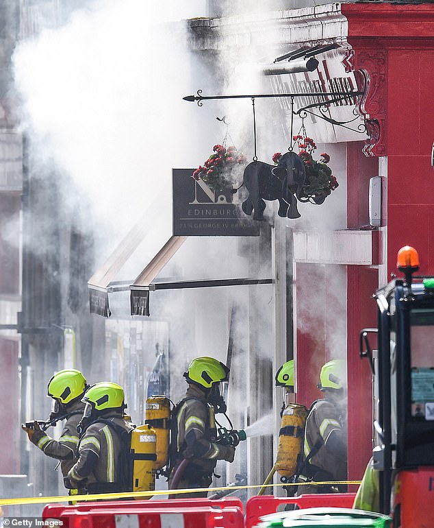 Firefighters tackle the blaze at The Elephant House Café in Edinburgh on August 24, 2021