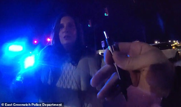After continuing to question the sobriety test for several minutes, Bucci was handcuffed, which only seemed to fuel her fury as she called the officer a 'loser'
