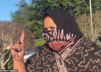 A headscarf-wearing woman scolded a journalist for asking her if she is running a daycare out her Washington home