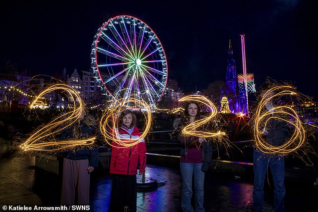 Revellers draw out 2026 with their sparklers as they celebrate New Year's Eve in Edinburgh