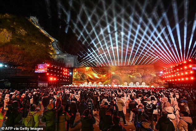 Dancers perform at the Juyongguan Great Wall, Beijing, on January 1 as revellers celebrate the New Year
