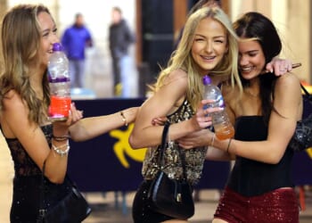 New Year’s Eve revellers brave freezing temperatures to ring in 2026 in style in pubs and bars across UK