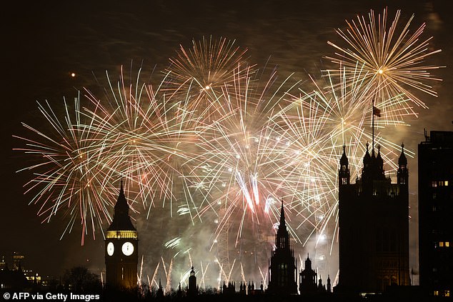 Fireworks explode in the sky to bring in the New Year around the London Eye and the Elizabeth Tower