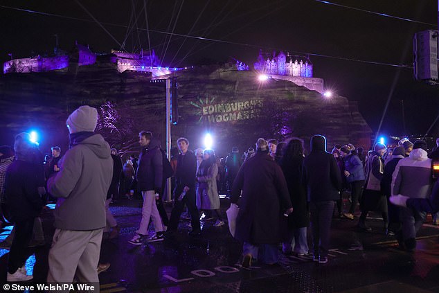Partygoers during the Hogmanay New Year celebrations in Edinburgh on New Year's Eve